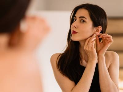 Woman trying on jewelry during a home trial